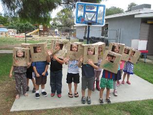 kidos using their imagination in the great big yard at the daycare